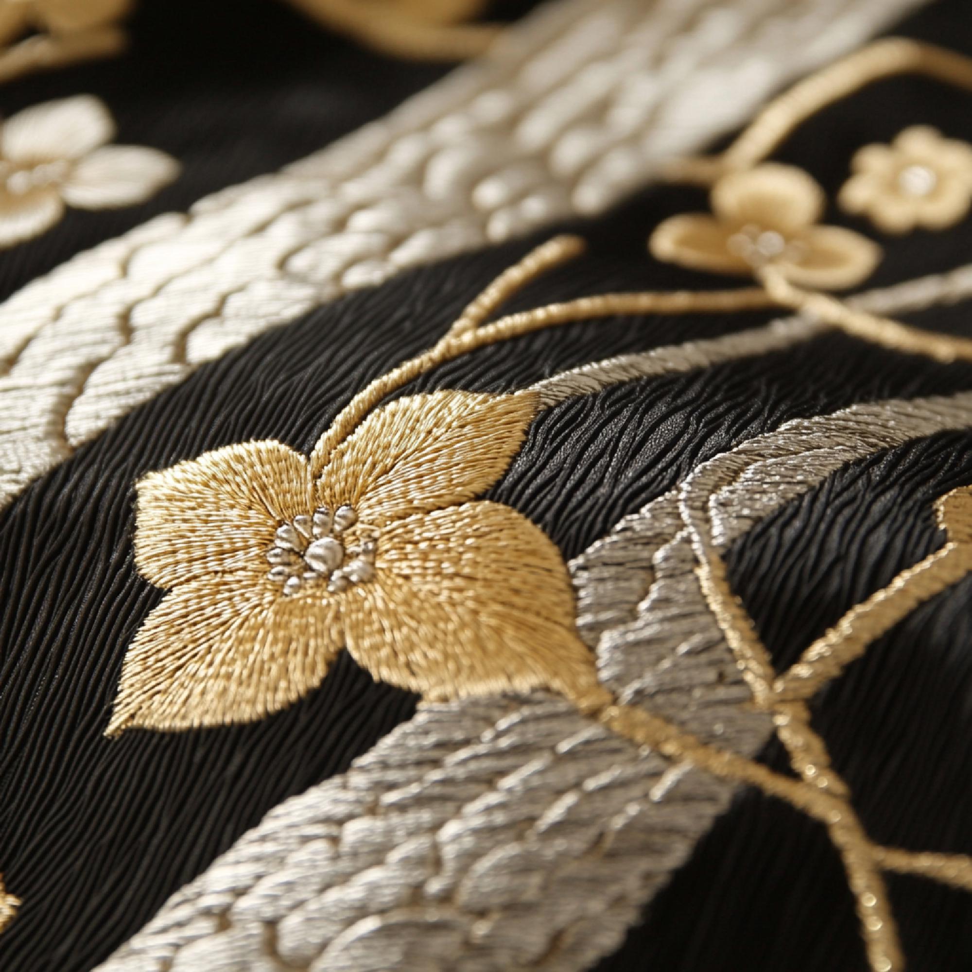 Close-up of gold thread embroidery on silk, luxury stitch detail